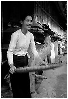 Woman of the Thai ethnicity sorting grain, near Mai Chau. Vietnam ( black and white)