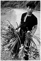 Man of Hmong ethnicity selling wild orchids, near Moc Chau. Vietnam ( black and white)