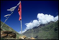 Prayer flag and cloud-capped peak, Himachal Pradesh. India