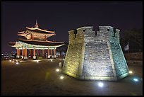 Crossbow tower and command post at night,  city lights, Suwon. South Korea ( color)