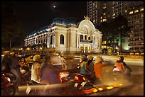 Motorbikes and colonial-area Opera House at night. Ho Chi Minh City, Vietnam ( color)