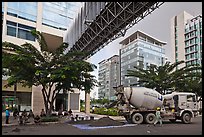 Asphalt truck and new urban area, Phu My Hung, district 7. Ho Chi Minh City, Vietnam ( color)