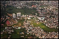 Aerial view of houses and high-rises on the outskirts of the city. Ho Chi Minh City, Vietnam ( color)