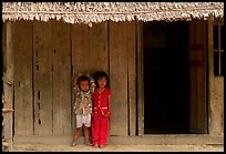 Two kids in front of a hut. Hong Chong Peninsula, Vietnam