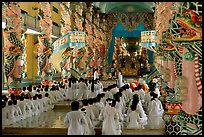 The noon ceremony, attended by priests inside the great Cao Dai temple. Tay Ninh, Vietnam ( color)