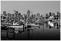 Fishing boats and skyline at night. Vancouver, British Columbia, Canada (black and white)