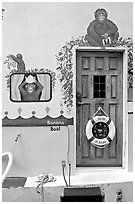 Door of houseboat decorated with a monkey theme. Victoria, British Columbia, Canada (black and white)