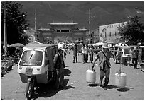 Street activity in front of the West gate. Dali, Yunnan, China (black and white)