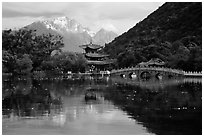Pavillon and Jade Dragon Snow Mountains reflected in the Black Dragon Pool. Lijiang, Yunnan, China (black and white)