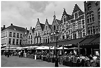 Restaurants and old houses on the Markt. Bruges, Belgium (black and white)