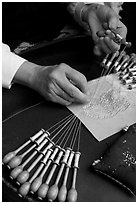 Hands of a lacemaker at work. Bruges, Belgium ( black and white)