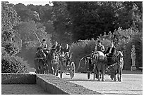 Horse carriages in the Versailles palace gardens. France (black and white)