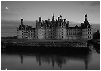 Chambord chateau at dusk with moonrise. Loire Valley, France ( black and white)