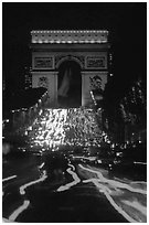 Arc de Triomphe and lights of cars on Champs Elysees. Paris, France ( black and white)