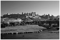 Aude River, Pont Vieux and medieval city. Carcassonne, France (black and white)