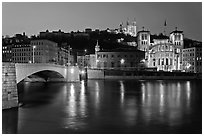 Napoleon Bridge, Saone River and Fourviere Hill at night. Lyon, France (black and white)