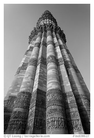 Qutb Minar seen from base, tallest brick minaret in the world. New Delhi, India (black and white)