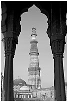 Qutb Minar tower framed by columns. New Delhi, India ( black and white)