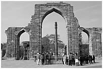 Iron pillar, and ruined mosque arch, Qutb complex. New Delhi, India ( black and white)