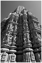 Sculptures and sikhara of Devi Jagadamba temple from below. Khajuraho, Madhya Pradesh, India ( black and white)