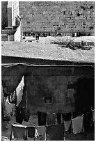 Laundry in a courtyard, with the Western Wall in the background. Jerusalem, Israel (black and white)