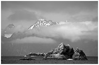 Rocky islets and cloud-shrouded peaks, Aialik Bay. Kenai Fjords National Park, Alaska, USA. (black and white)