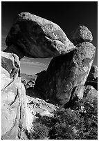 Arch formed by balanced boulder, Grapevine mountains. Big Bend National Park, Texas, USA. (black and white)