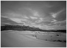White sand dunes, Guadalupe range, and clouds at sunset. Guadalupe Mountains National Park, Texas, USA. (black and white)