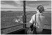 Tourist looking at the view from Hot Springs Mountain Tower in the fall. Hot Springs National Park ( black and white)