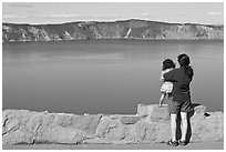 Woman and baby looking at Crater Lake. Crater Lake National Park ( black and white)