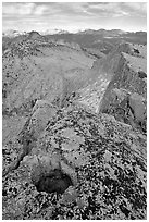 Frozen pot hole and summit cliffs, Mount Hoffman. Yosemite National Park, California, USA. (black and white)