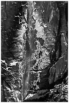 Upper Yosemite Falls and icy rock wall. Yosemite National Park, California, USA. (black and white)