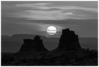 Sun setting between rock towers. Arches National Park ( black and white)