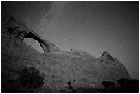 Skyline Arch at night with starry sky. Arches National Park ( black and white)