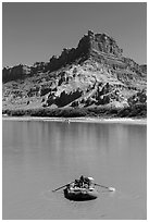 Woman paddling raft on Colorado River. Canyonlands National Park, Utah, USA. (black and white)