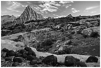 Black volcanic boulders and Pectol Pyramid. Capitol Reef National Park, Utah, USA. (black and white)