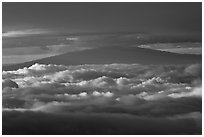 Mauna Kea between clouds, seen from Halekala summit. Haleakala National Park ( black and white)