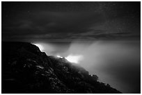Lava makes contact with ocean on a stary night. Hawaii Volcanoes National Park, Hawaii, USA. (black and white)
