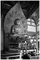 Amida seated on a lotus flower, the largest Buddha statue carved in over 900 years, Byodo-In Temple. Oahu island, Hawaii, USA ( black and white)
