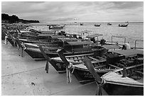 Longtail boats lined up, Ao Ton Sai, Ko Phi Phi. Krabi Province, Thailand (black and white)