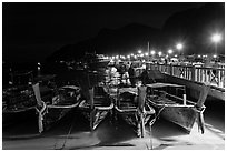 Long tail boats and pier at night, Ko Phi Phi. Krabi Province, Thailand (black and white)