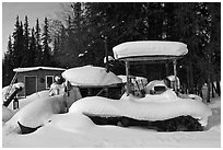 Machinery covered in snow. Wiseman, Alaska, USA (black and white)
