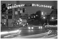 Broadway at night with lights from moving cars. Burlingame,  California, USA (black and white)