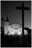 Cross and Santa Clara Mission at dusk. Santa Clara,  California, USA ( black and white)