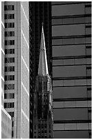 Church spire and modern buildings. Chicago, Illinois, USA ( black and white)