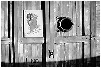 Wooden door with cuba poster. Key West, Florida, USA (black and white)