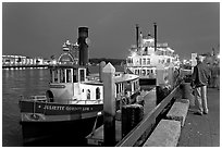 Ferry and riverboat on Savannah River at dusk. Savannah, Georgia, USA ( black and white)