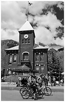 Mountain bikers in front of San Miguel County court house. Telluride, Colorado, USA ( black and white)