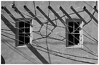Detail of art installation on facade of adobe building. Santa Fe, New Mexico, USA (black and white)