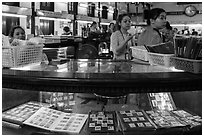 Stamp vending booth in central post office. Ho Chi Minh City, Vietnam (black and white)